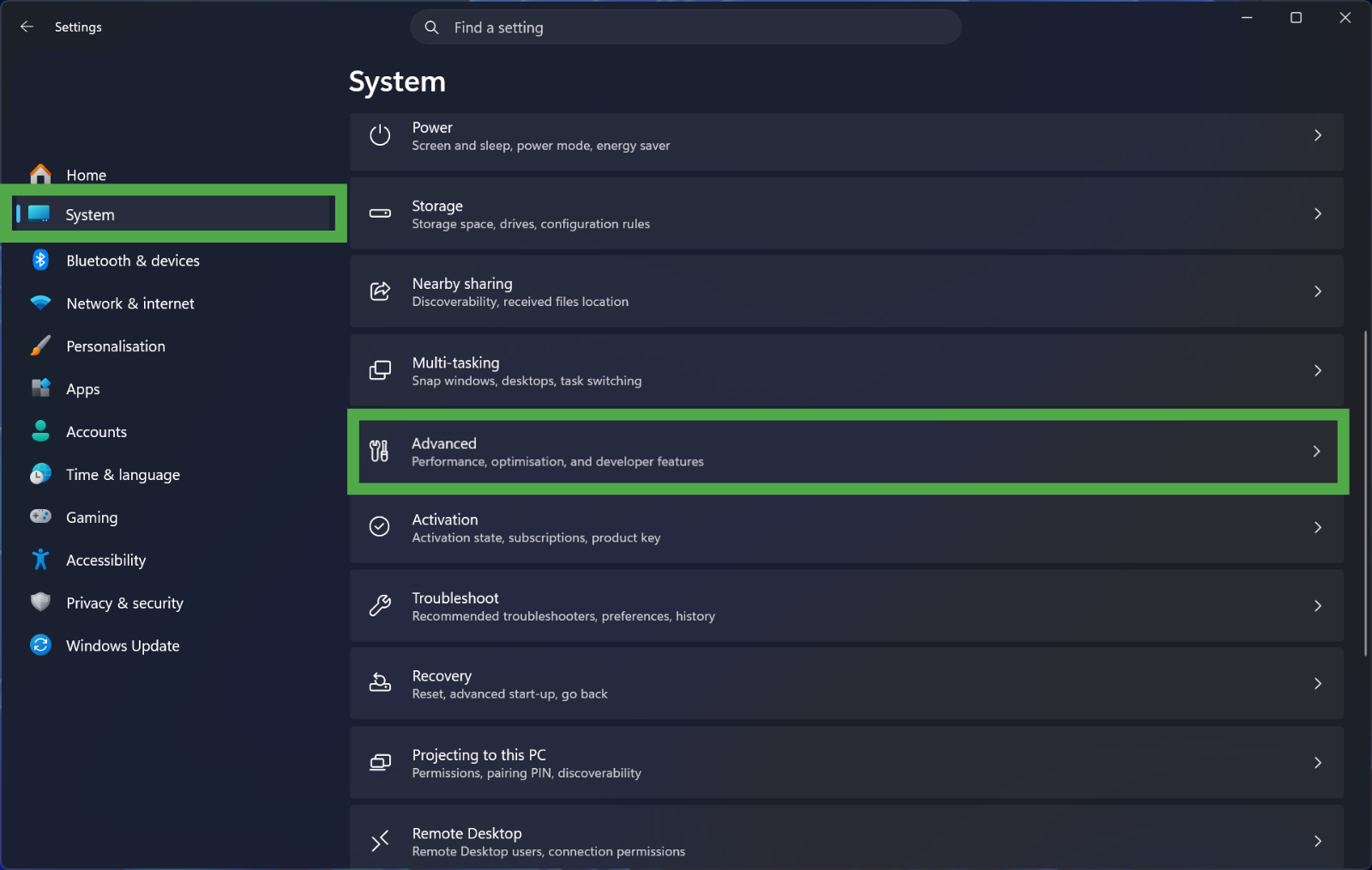 Windows 11 "System" settings menu, with the "Advanced" option highlighted in a green box.