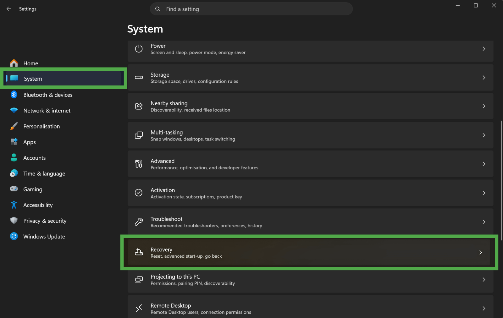 Windows Settings menu, with the "Recovery" option highlighted in a green box under the "System" tab.