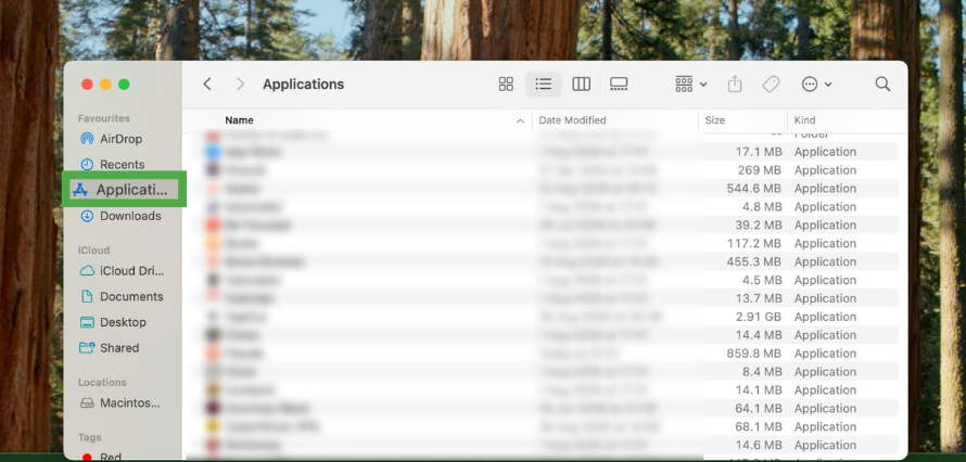 Finder window on macOS showing the Applications folder selected in the sidebar.