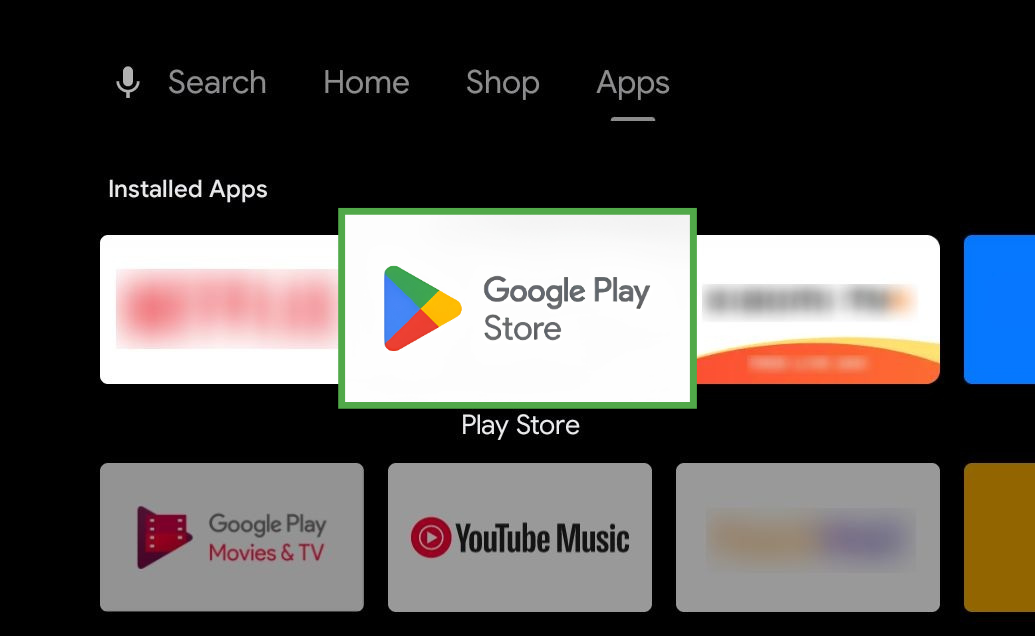 Android TV Apps screen showing installed apps with a focused overlay on the Google Play Store icon, which is highlighted by a green box.